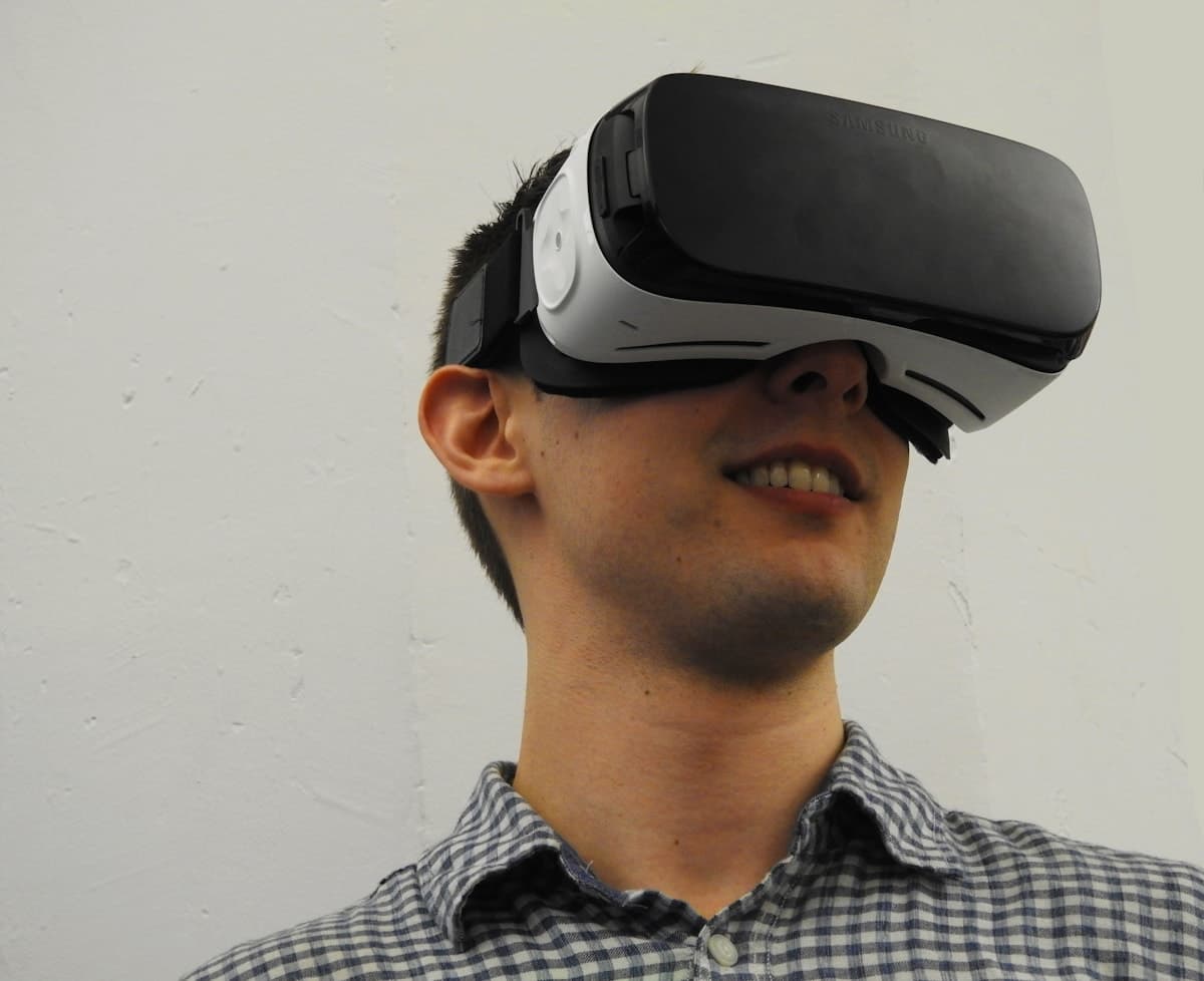 Person experiencing an application through a virtual reality headset