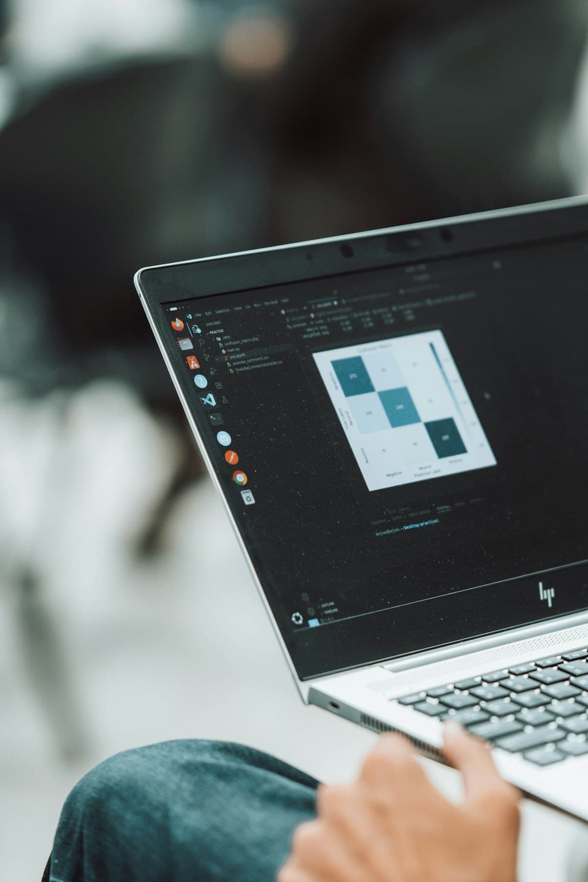 Data visualization and development tools displayed on a laptop